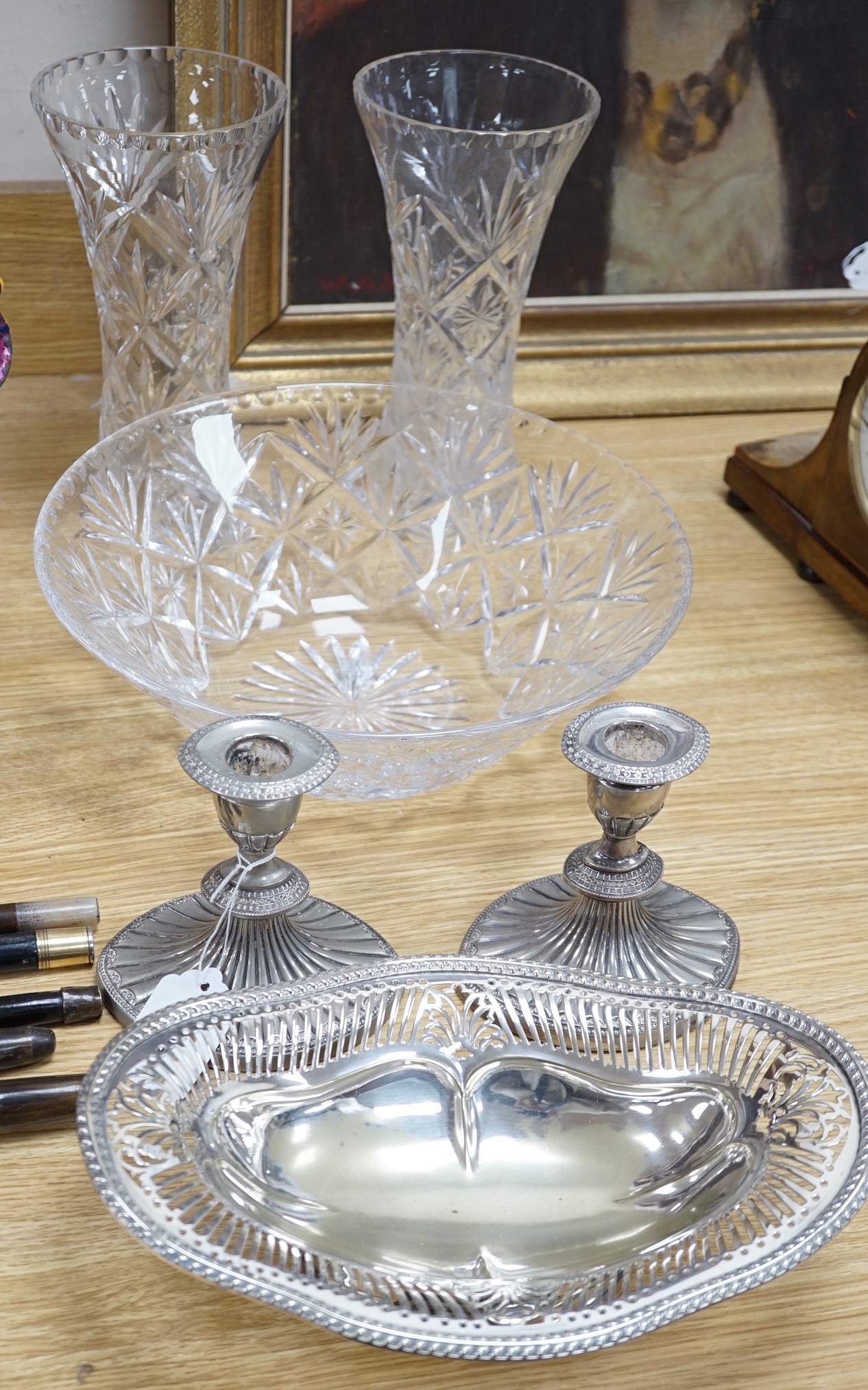 A pair of Doulton cut glass vases and a bowl plus a pair of silver plated candlesticks and a dish, vases 25cms high